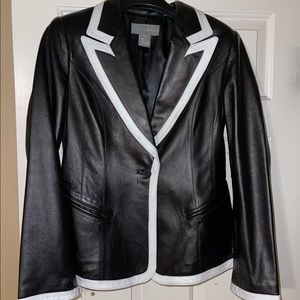 Beautiful black leather jacket with white leather trim.